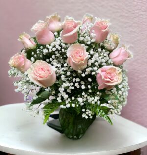 Dozen Medium Stemmed Roses in a adorable arrangement